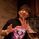Naoki Yoshida talks into the camera.